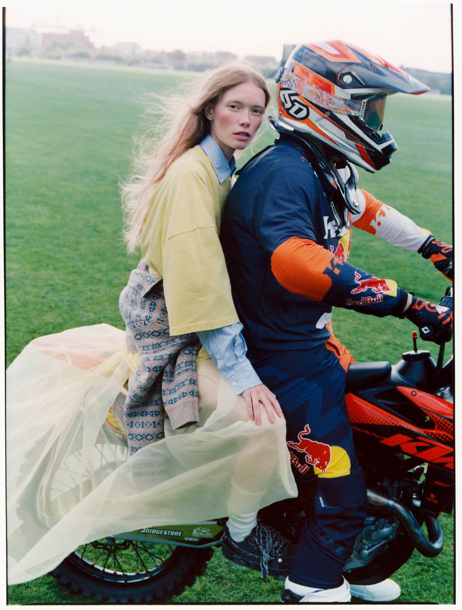 model on back of motorbike