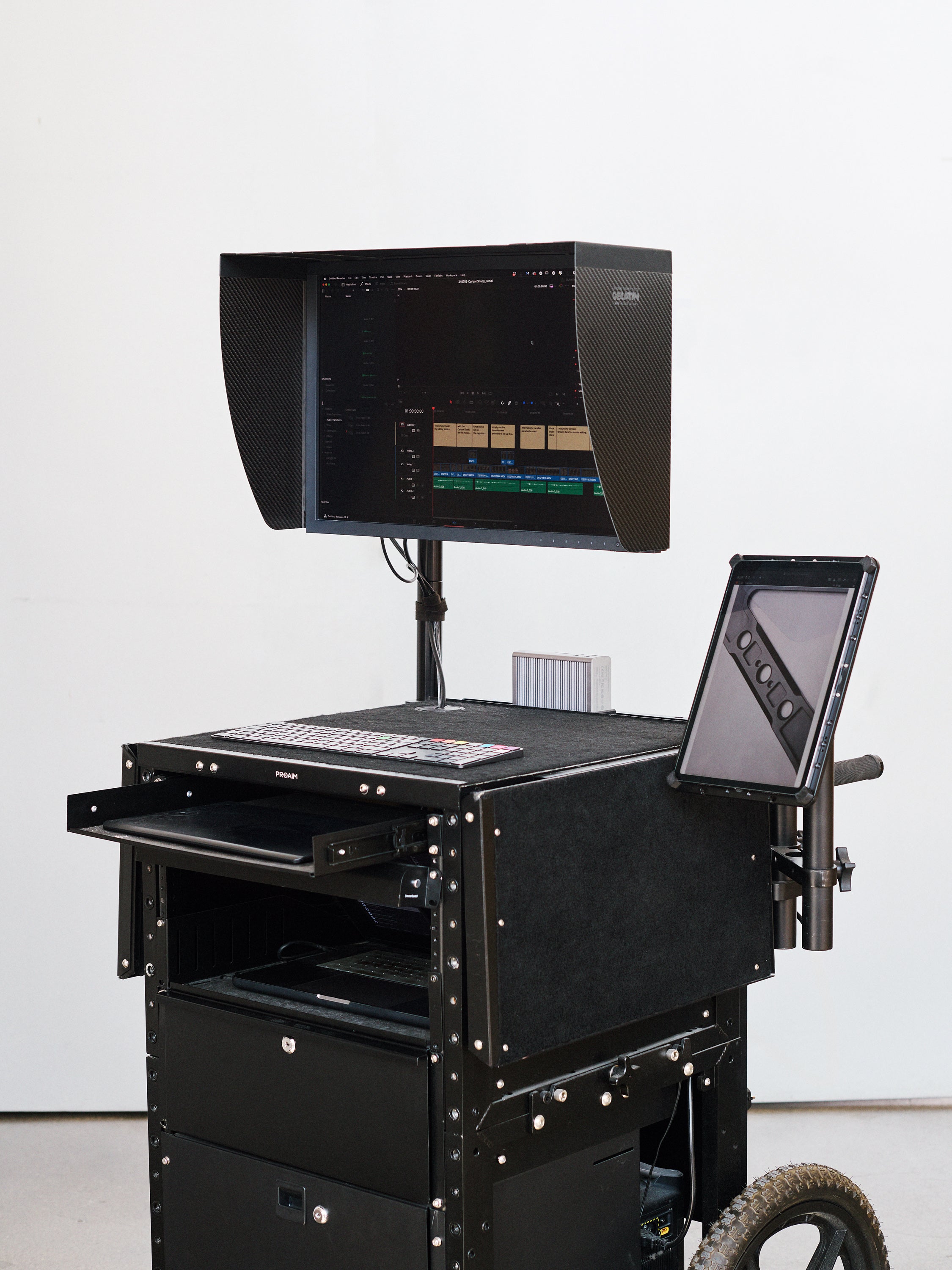 Carbon Fibre Hood for eizo screen, mounted on an inovativ deploy type cart.  Additional iPad Pro used as a vertical screen on an xLamina iPad mounting system