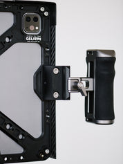 iPad Pro cage cheeseplate mounting system with 3/8"-16 screw holes for accessories including v-lock battery and NATO rail with magic arm and NATO rail handles.